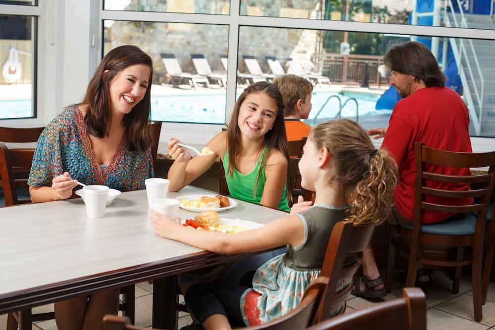 family eating breakfast at the Greystone Lodge