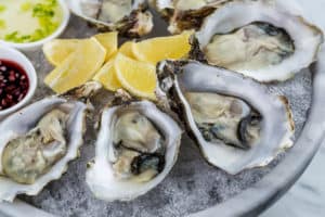 raw oysters on ice with lemon