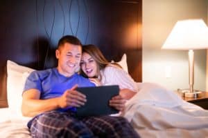 couple in bed at King Room